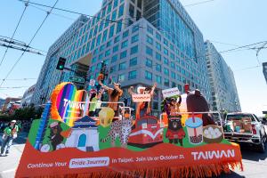 Taiwan tourism float featuring Taipei 101, sky lanterns, cultural landmarks, wildlife, bubble tea, and OhBear mascot.