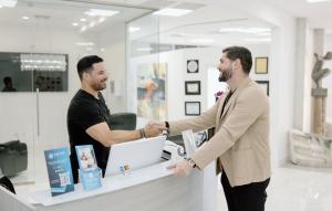 Aspire Rejuvenation CEO Tomo Marjanovic with Edgard Robles at the Orlando office