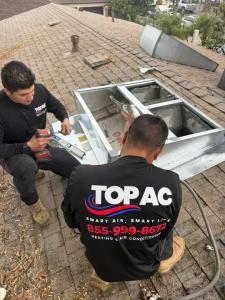 TOP AC Inc. certified technicians performing AC repair on a rooftop in Los Angeles CA