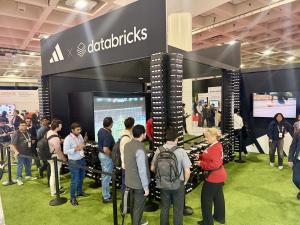 Crowd lined up to experience Los Virtuality's Soccer Simulator at the Adidas booth during the Databricks Data + AI Summit 2026 in San Francisco.