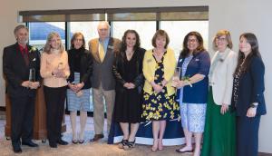 Award recipients standing together and smiling in business attire. From left to right: Stephen Amico, Susan Rose, Maria Vafiades, Joseph C. Hayes, Krystin Ruzzano, Jamie Sawtelle, Lisa Santaniello, Nancy Karstunen, Heather Carlisle.