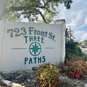The Three Paths Distillery sign at 723 Front Street in Comfort, TX.