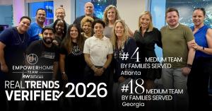 Professional portrait of Team Leader Linde Moore with the EmpowerHome Team Atlanta logo and a 2026 RealTrends Verified Georgia ranking graphic.
