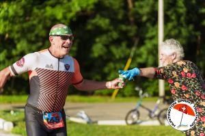 Woman handing man cup of Gatorade