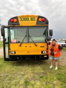 Shaina proudly showing off her bus.