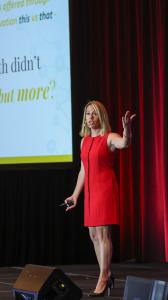 Dr. Melissa Grill-Petersen on stage delivering a keynote presentation on the Healthspan Index as a global metric for human vitality and thriving