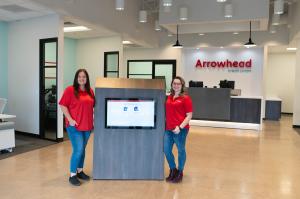 Two Arrowhead team members in the lobby of Arrowhead's new Bullhead City branch.