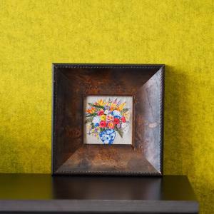 Needle Talks Art's Features an intricately detailed bouquet of multi-colored European wildflowers arranged inside a classic blue-and-white glazed earthenware vase. This romantic design brings an aura of rustic elegance and perpetual spring into your living space.