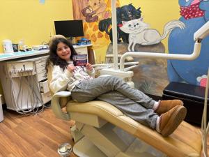 Child smiling in a kid friendly dental exam room at Star Dental in Denver Lakewood.