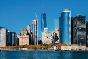 Lower Manhattan skyline featuring One World Trade Center from the water, representing U.S. market expansion and global investment opportunities.