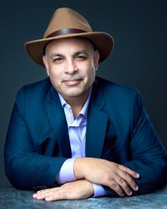 Portrait photograph of Jonathane Ricci, dual-licensed wealth-orchestration attorney and forthcoming host of the UNJUST MATTERS™ educational podcast.