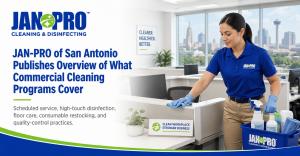 A JAN-PRO Cleaning & Disinfecting professional servicing an office workspace in San Antonio, illustrating a commercial cleaning program that includes recurring service, high-touch disinfection, floor care, restocking, and quality-control practices.