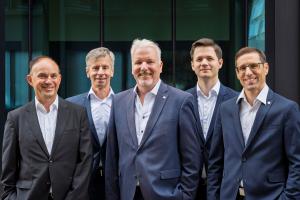 The five members of the Securosys management team standing side by side. From left to right: Marcel Dasen (Executive VP Engineering), Andreas Curiger (CTO/CSO), Robert Rogenmoser (CEO), Pal Blasko (CFO), and Reto Stäuble (Executive VP Solutions & Services
