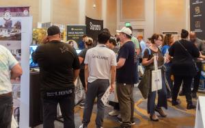 Attendees talking to ADU companies at BAAE Spring 2026