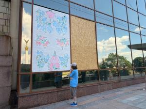 Liubava Malitska looks at her artwork after it was installed inside Hotel Ukraina in Kyiv.
