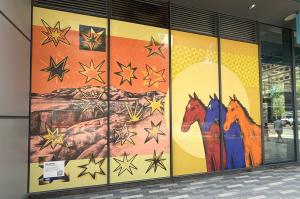mural with horses and mountain ranges is a reworking of Western iconography