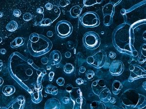 Photograph of bubbles frozen in time in glacier ice