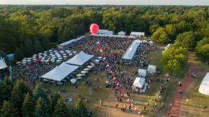 Aerial view of Veggie Fest Chicago showing large crowds, vendor tents, and vibrant festival activity across the outdoor grounds.