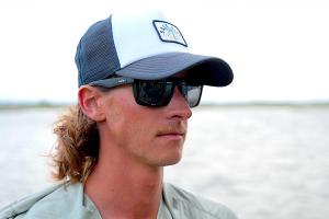 Angler wearing SALT LIFE polarized sunglasses from the limited-edition FishAmerica Foundation collection