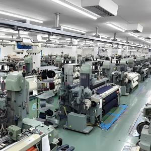 Ryoma's ramie fabric weaving mill with rows of advanced looms in Japan