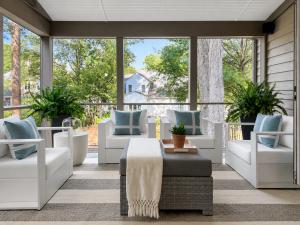 Small details make outdoor spaces feel intentional. Comfortable seating, layered textiles, and fresh greenery invite buyers to imagine relaxing outdoors every day.