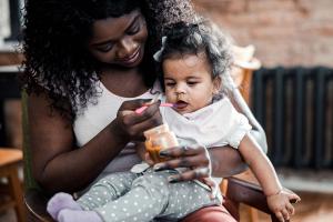 speech therapist working with a toddler