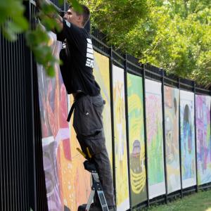 nstallation of the "Echoes Beyond the Stage" mural series on the entrance gates of the Highmark Mann Center for the Performing Arts in Philadelphia