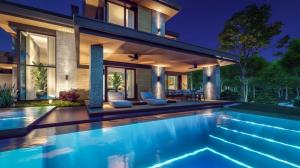 Luxury villa in Portugal at dusk, modern swimming pool, off-plan luxury new home