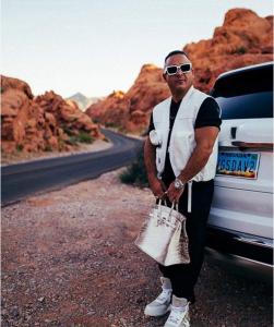 Vegas Dave with Silver Purse and White Glasses