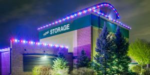 This is an image of a storage building with lights installed along the roofline.