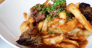 Beef Short Rib Poutine served at ARC Restaurant in the Fairmont Waterfront, featured in Robert Lawrence Vancouver's restaurant review.