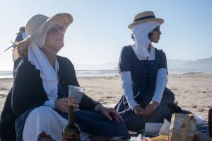 two sisters at the beach enjoying a moment