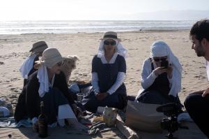 four sisters at the beach with a documentary filmmaker (man)