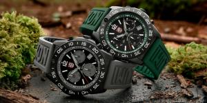 Luminox Pacific Diver Chronograph 3140 watches in Forest Green and Graphite Grey with black IP stainless steel cases and rubber straps displayed on moss-covered forest ground.