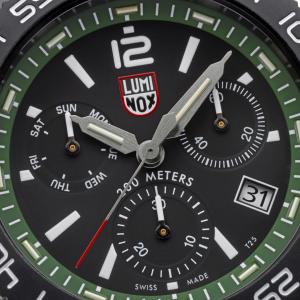 Close-up of the Luminox Pacific Diver Chronograph 3140 Forest Green watch dial showing chronograph subdials, date window, hands, markers, and green outer ring.