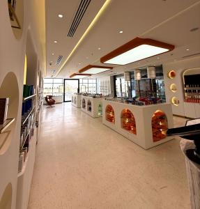 Interior of an on-site pharmacy and patient care center within a modern hair transplant clinic in Saudi Arabia.