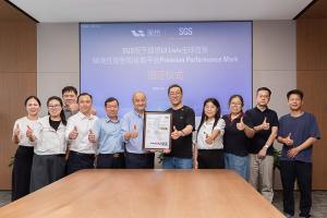Representatives from SGS and Li Auto stand in a row giving thumbs-up in a meeting room, with two men at the center holding a framed SGS certificate.