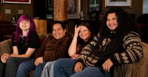 Group photo of four students graduating high school with proficiency in Northern Pomo
