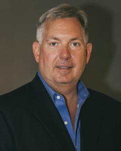 Headshot of Robert Simmons, smiling.