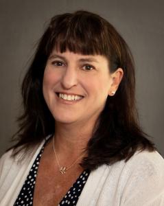 Headshot of Melanie Smart, smiling.
