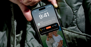 An image of a cell phone with a notification that a game is in progress and a team has just scored