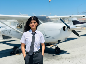 Young female aviation student at Orange County Flight Center after earning her FAA Private Pilot Certificate and Instrument Rating in the United States