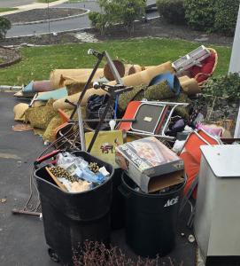Ripped up carpet and other junk removed from the home