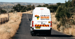 Safari World Tours Shuttle Transfer Namibia along a scenic rural road.