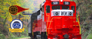 Bright red Western Maryland scenic train 501 traveling on tracks through a green forest with CAC Certified Autism Center and WM logos.