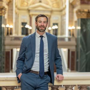 A photo of Attorney Evan Tenebruso standing inside the Madison Capitol