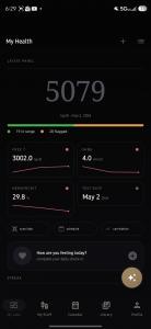 Screenshot of the redesigned My TRT App Android My Health screen showing the latest total testosterone value in large serif numerals, in-range and flagged biomarker counts, and trend cards for free testosterone, SHBG, and hematocrit.