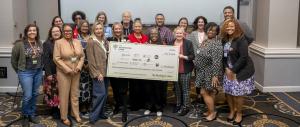 Photo of Group Receiving Grant Check
