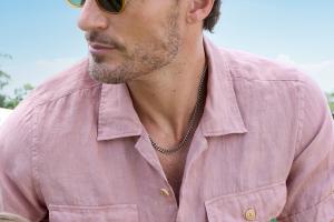 Model wearing With Clarity's men's jewelry collection