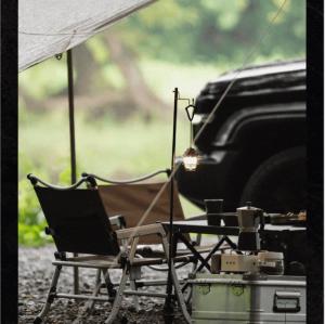 SunnyFeel folding chair and table with moka pot and hanging lantern under a tarp at a campsite